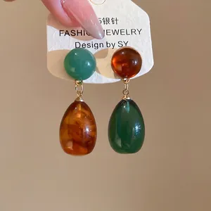 Asymmetric resin waterdrop earrings with 925 silver needle in green and amber tones