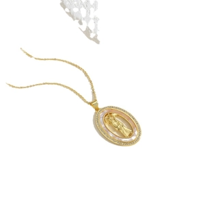 Golden oval pendant necklace with Madonna relief, shell inlay and small zircon accents