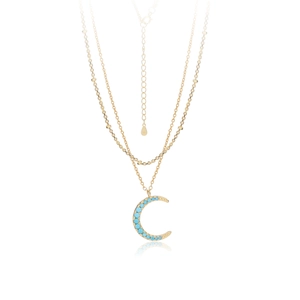 Detail of double-layer gold S925 silver necklace with turquoise crescent moon pendant