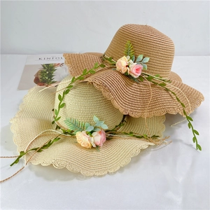 Women's foldable wide brim straw hats with floral decor and wavy edges for beach sun protection