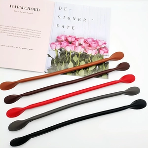 Close-up of leather handbag straps in five colors with pre-drilled sewing holes