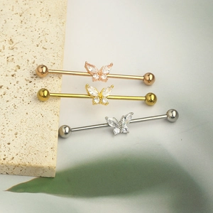 14G industrial barbell set with butterfly zircon details in gold, rose gold, and silver