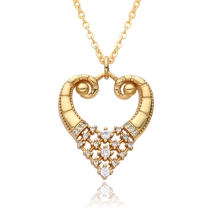 Detailed close-up of 18k gold plated heart pendant with zircon inlay and mirror reflection