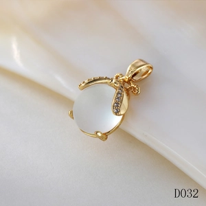 Macro shot of gold Ruyi lock pendant with moonstone and sparkling cubic zirconia detail