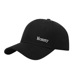 Classic black cotton baseball cap with white Mommy embroidery on a minimalist structure