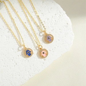 Golden Hamsa Hand necklaces with blue pink and purple enamel and micro-zirconia inlay