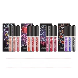 Three-piece Halloween lip gloss set with purple and black punk style skull packaging