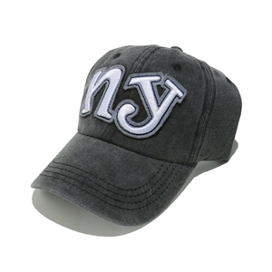 Detail of dark gray washed cotton baseball cap with vintage NY letter embroidery