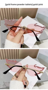 Detail of pink flame rimless sunglasses with gold frame and sparkling rhinestones