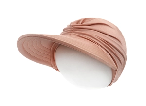 Detail of rose gold sun visor hat with pleated metallic fabric on display head