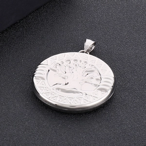 Polished silver stainless steel tree of life pendant with geometric border details