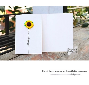 Detail of 3D handmade sunflower greeting card with Thank You text on rustic wood