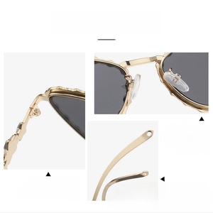 Detail view of gold metal hinges, silicone nose pads, and ergonomic curved temples