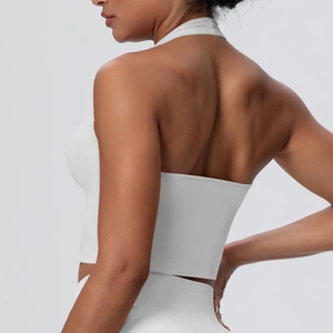 Close-up of a white high-stretch halter neck sports bra featuring an open back design