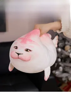 Close-up of soft white plush seal doll being squeezed to show elastic squishy texture
