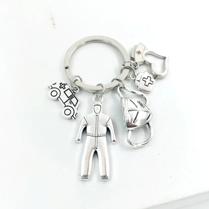 Silver medical keychain set with stethoscope heart and N95 mask charms in polished zinc alloy