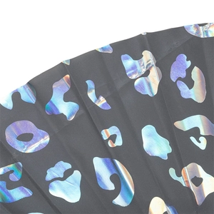 Macro shot of 33cm reflective rainbow leopard print on black bamboo folding fan material
