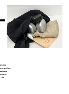 Top view of a black nylon oversized hobo bag showing spacious interior with daily items