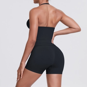 Detail view of high-waist yoga shorts with peach butt lift and elastic sculpting fabric