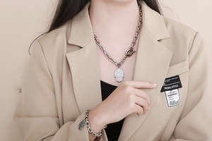 Detailed shot of Hamsa hand pendant necklace and bracelet set with OT toggle clasp