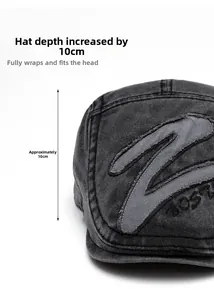 Detail view of washed denim flat cap with embroidery and a deep 10cm crown design