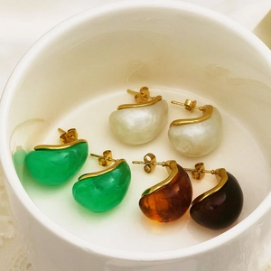 Detailed macro view of 18k gold plated square earrings with colorful resin inlay sets