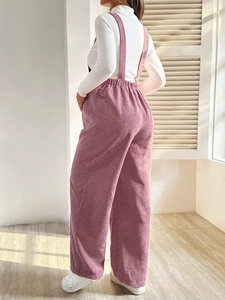 Pink corduroy maternity overalls with elastic waist and wide legs for autumn fashion