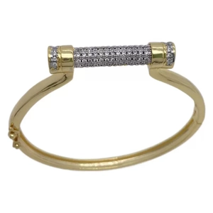Golden horseshoe D-shape bracelet featuring micro-paved cubic zirconia cylinder detail