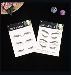 Detailed view of rhinestone face jewels in gold and silver for music festival makeup