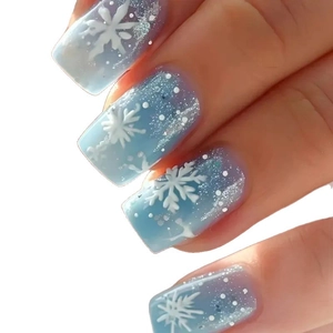 Unghie finte sfumate blu con fiocchi di neve bianchi e glitter argento per il Natale