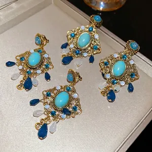 Bohemian vintage hollow gold earrings with turquoise stones and colorful bead charms