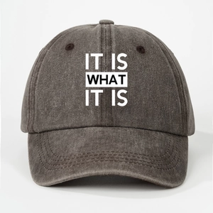 Detail of faded dark grey cotton canvas baseball cap with IT IS WHAT IT IS print