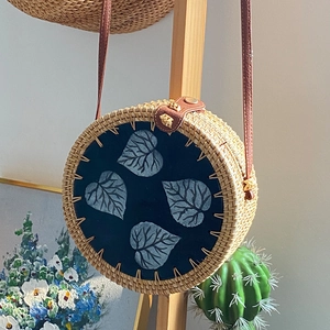 Handmade woven shell-shaped crossbody bag with blue leaf embroidery and leather strap