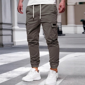 Men's solid color cargo jogger pants in sage green with drawstring waist and side pockets