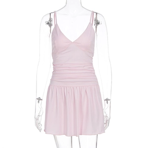 Detailed front view of pink bodycon mini dress featuring waist ruched and ruffled hem