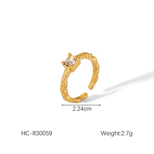 Detail view of golden bow knot ring with pearl and cubic zirconia showing 2.24cm diameter
