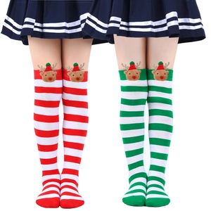 Detail of red and green striped Christmas knee-high socks with cute 3D reindeer dolls