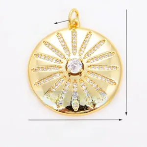 Macro view of gold sunburst pendant with zircon inlay showing 26mm diameter size details