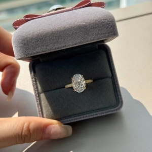 Close-up of luxury S925 sterling silver ring with oval cubic zirconia in a gift box
