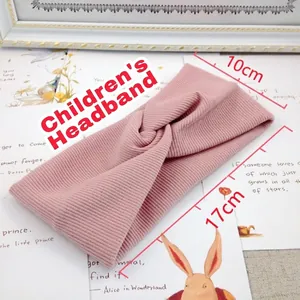 Pink knitted twist headband for toddlers with 17x10cm stretchy ribbed fabric