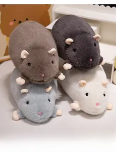 Close-up of four fluffy plush hamster dolls in brown, grey, and white colors