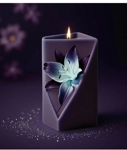 Macro detail of purple geometric candle with blue lily carving and lit flame