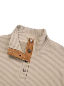 Detail of knitted men's sweatshirt with beige rib texture and brown suede placket