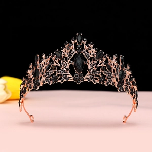 Macro detail of gothic rose gold bridal crown with vintage black marquise crystals