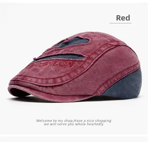 Detail of red washed cotton flat cap with BOSTON embroidery and blue denim patchwork