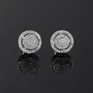 Macro shot of silver hip hop stud earrings with micro-pave cubic zirconia and reflection