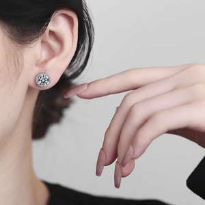 Halo stud earring with a 2-carat round-cut zircon centerpiece on a female model