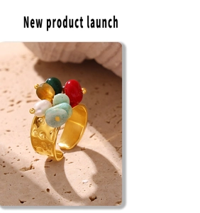 Detail of 18k gold plated hammered texture ring with colorful baroque natural stone beads