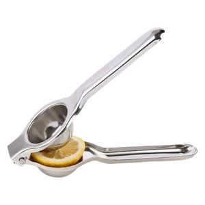 Manual stainless steel lemon squeezer tool with fresh fruit slice on white background