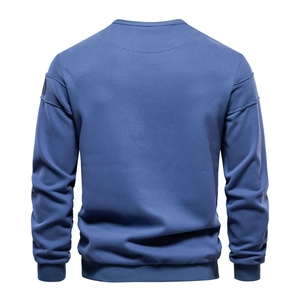Rear view of a sky blue crewneck sweatshirt featuring ribbed cuffs and detailed side seams